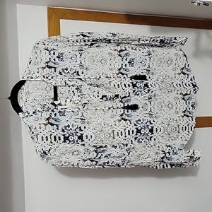 Black and white patterned blouse with tassels